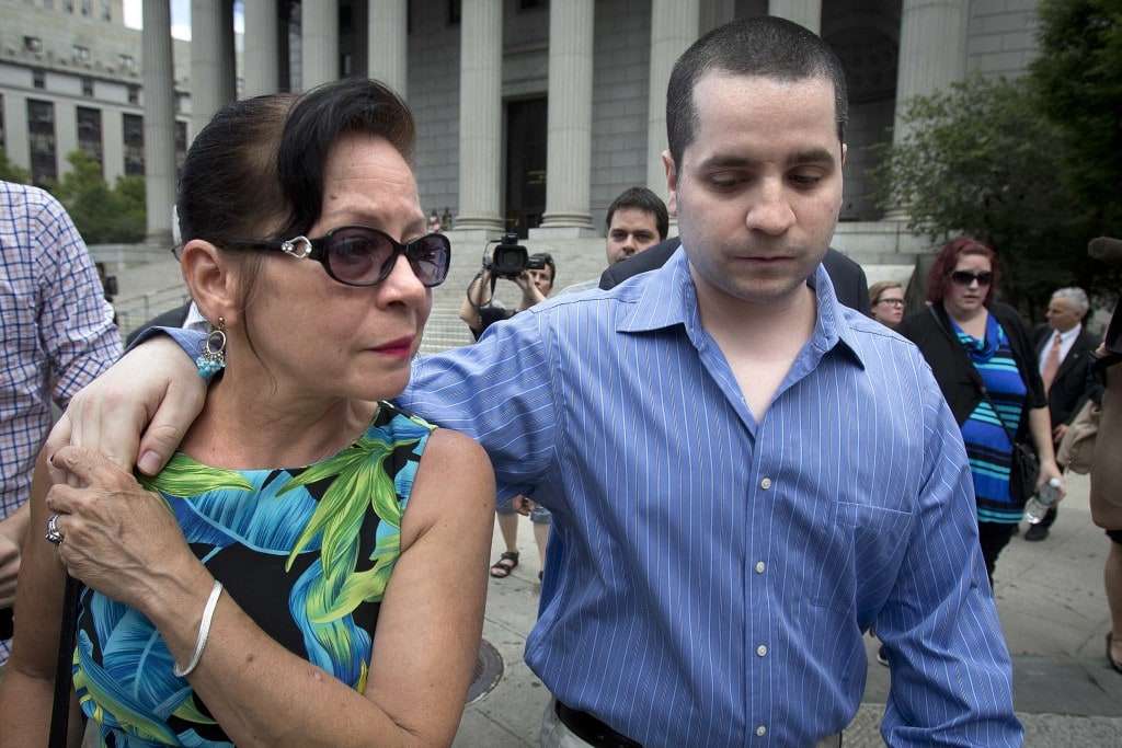 Former New York City police officer Gilberto Valle, dubbed by local media as the "Cannibal Cop," and his mother Elizabeth Valle leave the U.S. District Court for the Southern District of New York in Lower Manhattan July 1, 2014. U.S. District Judge Paul Gardephe in Manhattan threw out the conviction of Valle, 30, for plotting to kidnap, kill and cook women after federal public defenders argued that the U.S. Constitution grants people the right to fantasize, free from government interference. REUTERS/Carlo Allegri (UNITED STATES - Tags: CRIME LAW TPX IMAGES OF THE DAY)