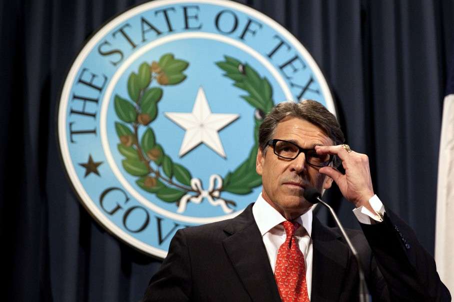 Gov. Rick Perry makes a statement at the capitol building in Austin, Texas on Saturday, Aug. 16, 2014 concerning the indictment on charges of coercion of a public servant and abuse of his official capacity. Perry is the first Texas governor since 1917 to be indicted. (AP Photo/The Daily Texan, Mengwen Cao)