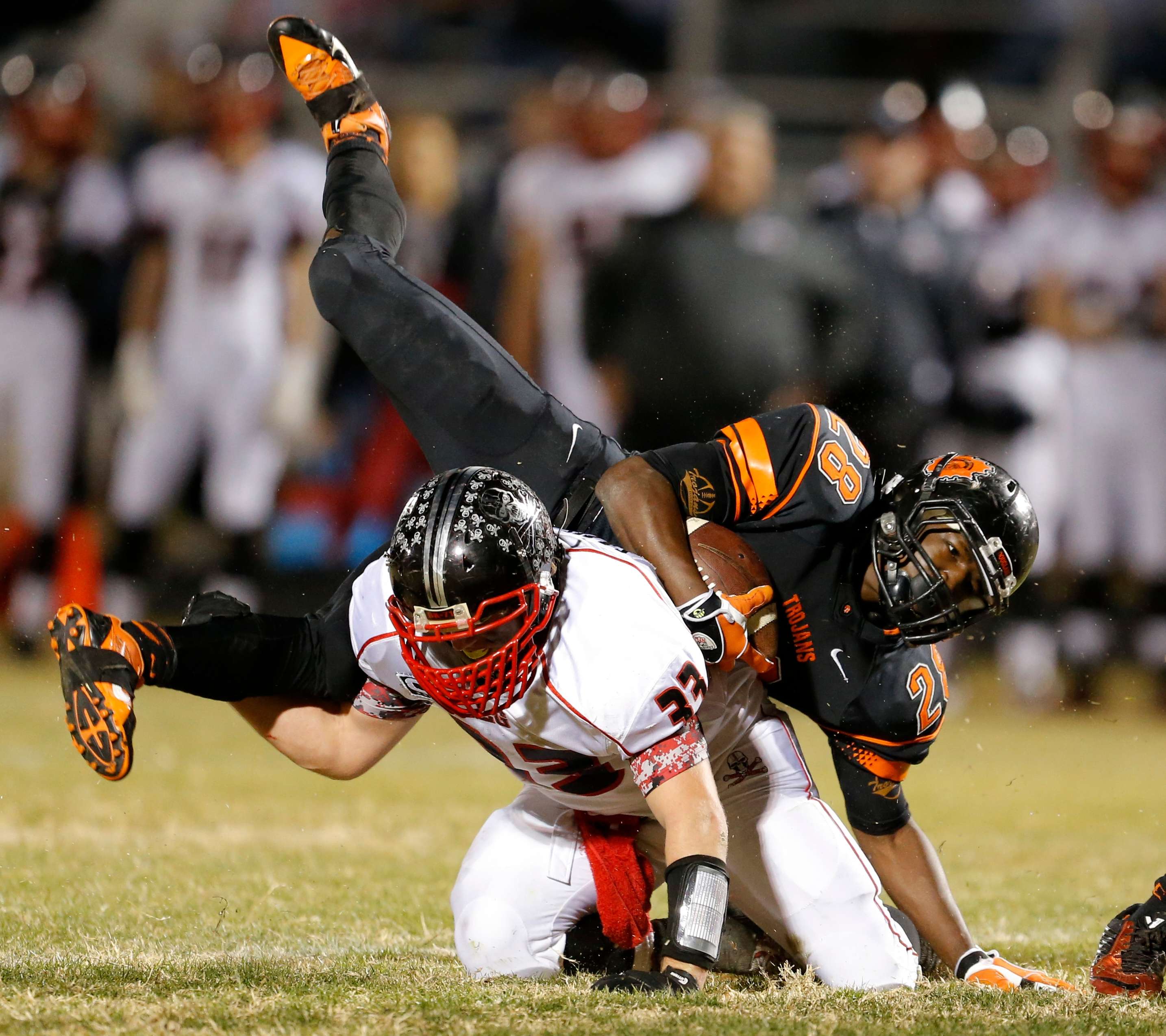 A Locust Grove player upends a Douglas player during a disputed November 28 playoff game.(AP Photo/The Oklahoman, Bryan Terry) LOCAL INTERNET OUT; LOCAL STATIONS OUT (KFOR,KOCO,KWTV,KOKH, KAUT OUT); LOCAL PRINT OUT (EDMOND SUN, NORMAN TRANSCRIPT, OKLAHOMA GAZETTE, SHAWNEE NEWS-STAR THE JOURNAL RECORD OUT); TABLOIDS OUT