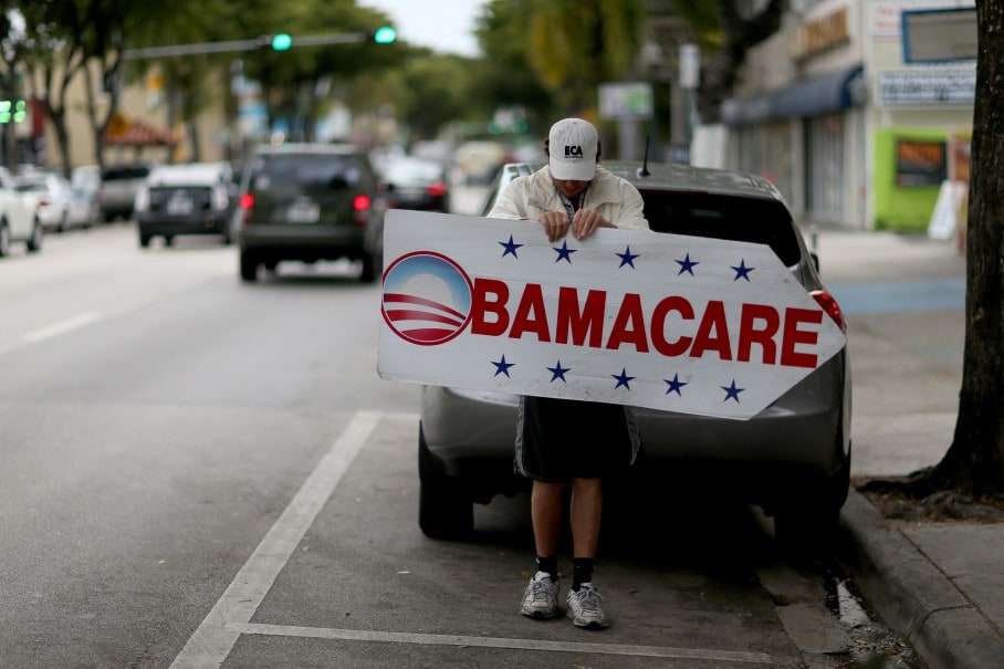 MIAMI, FL - FEBRUARY 05: Pedro Rojas holds a sign directing people to an insurance company where they can sign up for the Affordable Care Act, also known as Obamacare, before the February 15th deadline on February 5, 2015 in Miami, Florida. Numbers released by the government show that the Miami-Fort Lauderdale-West Palm Beach metropolitan area has signed up 637,514 consumers so far since open enrollment began on Nov. 15, which is more than twice as many as the next large metropolitan area, Atlanta, Georgia. (Photo by Joe Raedle/Getty Images)