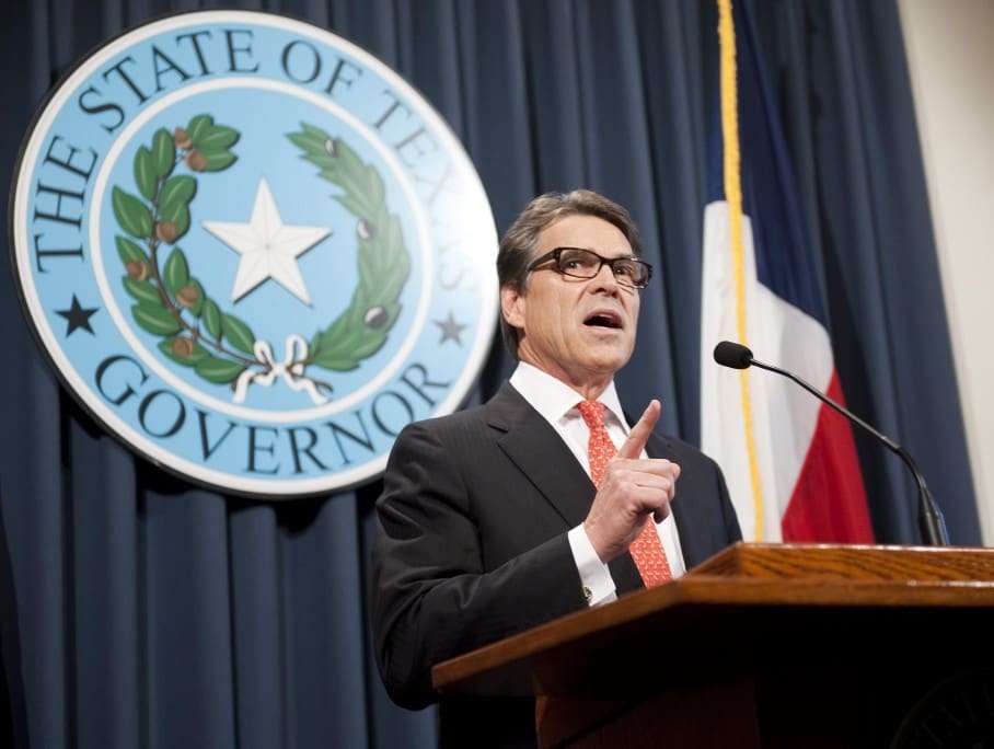 epa04357042 Texas Governor Rick Perry makes a statement regarding his grand jury indictment on charges of abuse of power at the Texas state capitol, in Austin, Texas, USA, 16 August 2014. Texas Governor Rick Perry lashed out at an indictment against him for abuse of power, calling it a political ploy against him. The Republican governor, who is seen as a possible candidate for president in 2016, was indicted on 15 August on two counts of abuse of power for allegedly threatening to veto funding for a district attorney's office in a bid to force her to resign. 'I am confident that we will ultimately prevail, that this farce of a prosecution will be revealed for what it is, and those responsible will be held accountable,' Perry told a press conference in Texas state capital Austin. EPA/ASHLEY LANDIS
