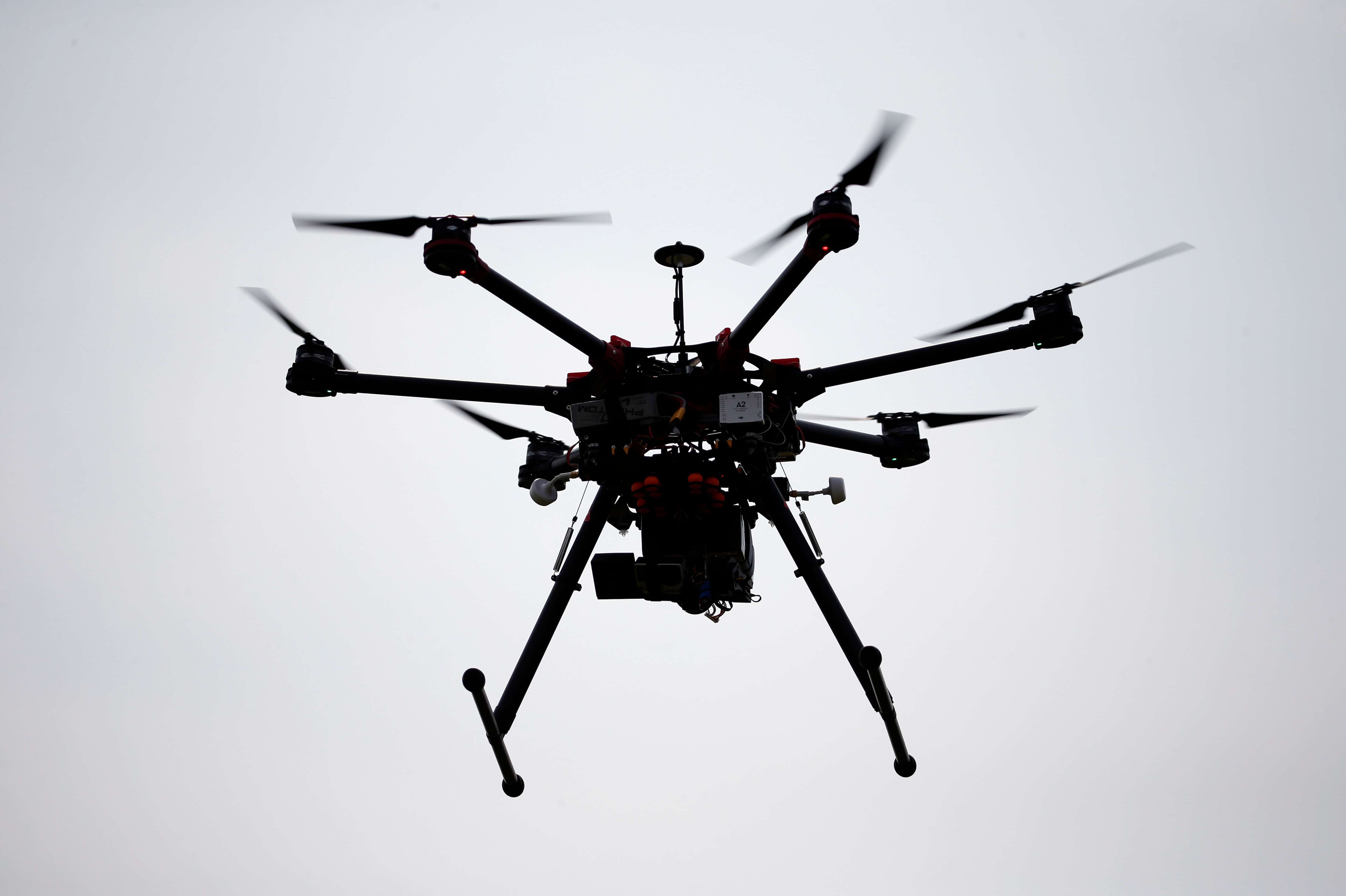 A hexacopter drone is flown during a drone demonstration at a farm and winery on potential use for board members of the National Corn Growers, Thursday, June 11, 2015 in Cordova, Md. (AP Photo/Alex Brandon)