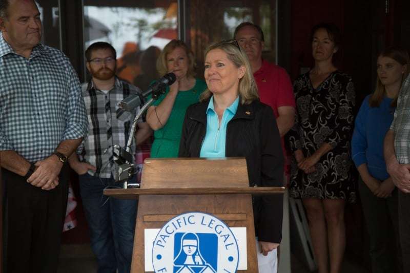 Donna Murr speaks at a press conference at the Murr family's cabin on the St. Croix River. The Murr family are the plaintiffs in Murr v. Wisconsin.