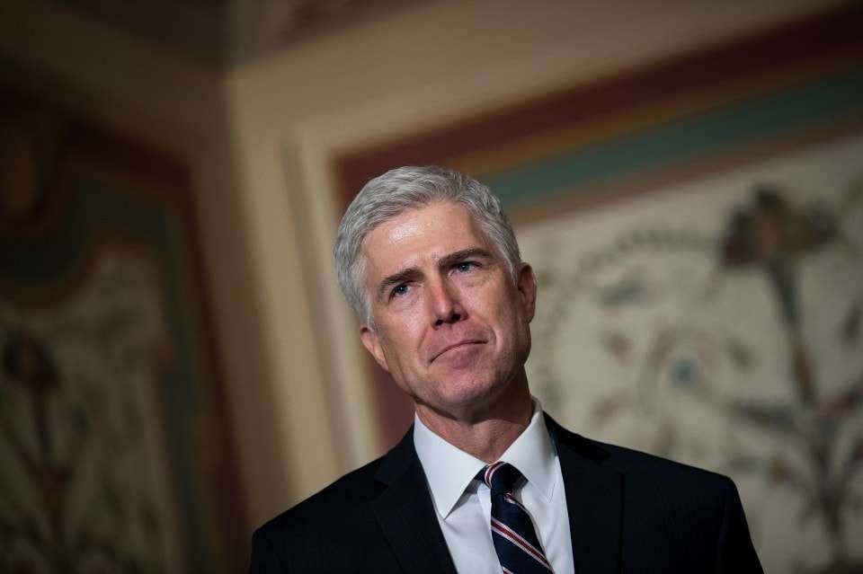 WASHINGTON, DC - FEBRUARY 1: Supreme Court nominee Neil Gorsuch looks on as Senate Judiciary chairman Sen. Chuck Grassley (R-IA) speaks to reporters before their meeting on Capitol Hill, February 1, 2017 in Washington, DC. President Donald Trump has nominated Judge Gorsuch to the Supreme Court to fill the seat that had left vacant with the death of Associate Justice Antonin Scalia in February 2016. (Photo by Drew Angerer/Getty Images)