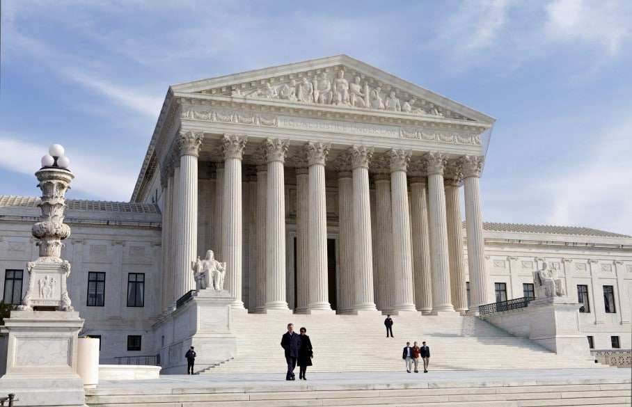 FILE - This Jan. 25, 2012, file photo shows the U.S. Supreme Court Building in Washington. A Supreme Court case over the legality of federal subsidies that help millions of Americans afford health coverage under President Barack Obama's health care law poses risks to both political parties. Republicans and conservatives who brought the case say many of those subsidies are illegal. Should they win, the states whose residents would be hurt are disproportionately represented by Republicans in Congress. (AP Photo/J. Scott Applewhite, File)