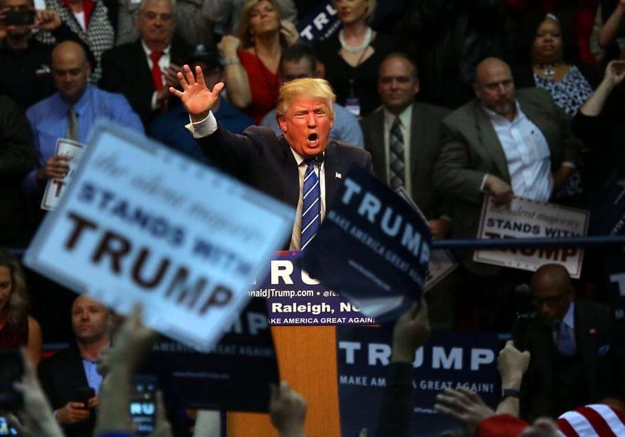 Republican presidential candidate Donald Trump energizes the crowd during a campaign rally at Dorton Arena in Raleigh, N.C., Friday, Dec. 4, 2015. (AP Photo/Ted Richardson)