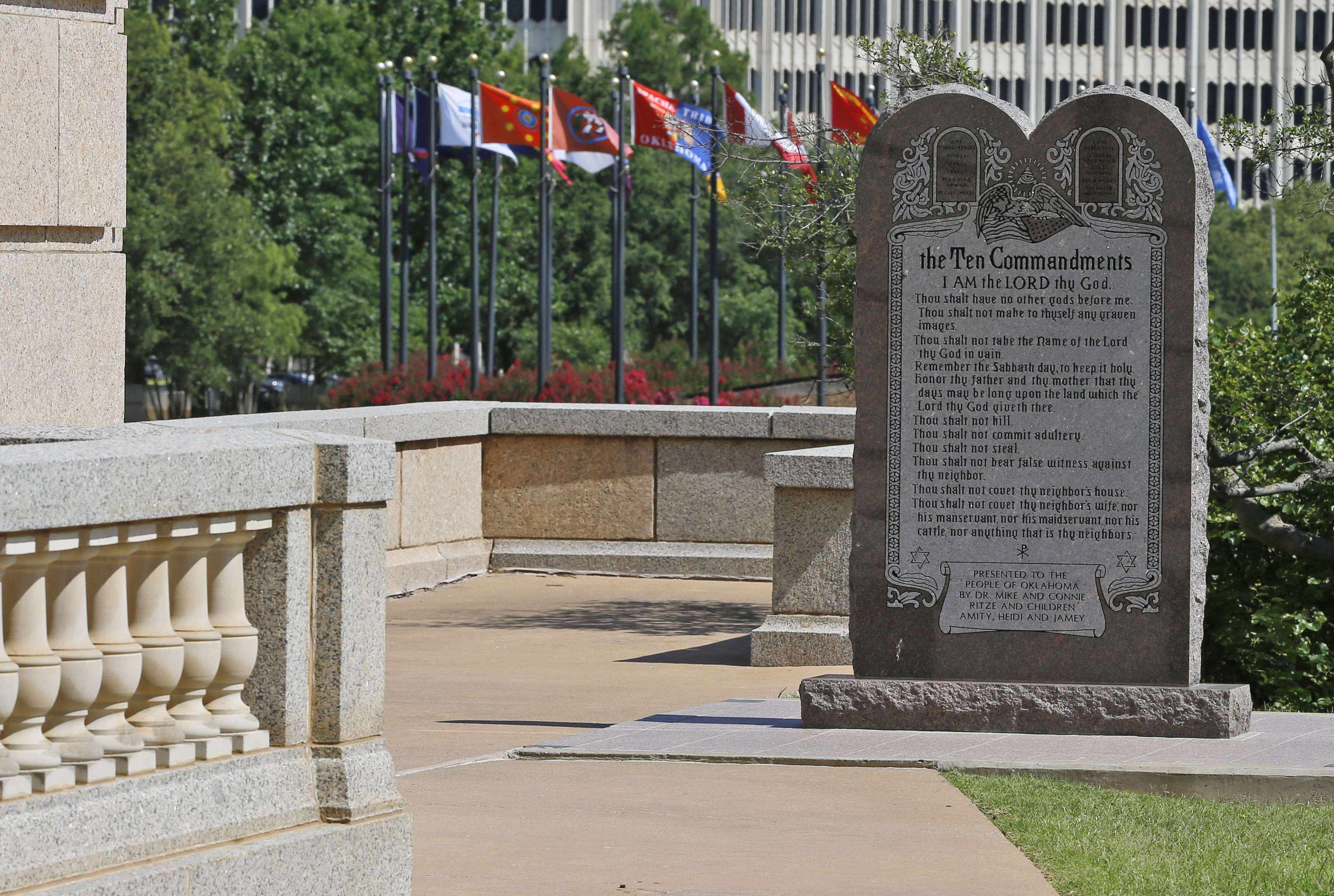 The Ten Commandments monument is pictured at the state Capitol in Oklahoma City, Tuesday, June 30, 2015. Oklahoma’s Supreme Court says the monument must be removed because it indirectly benefits the Jewish and Christian faiths in violation of the state constitution. (AP Photo/Sue Ogrocki)
