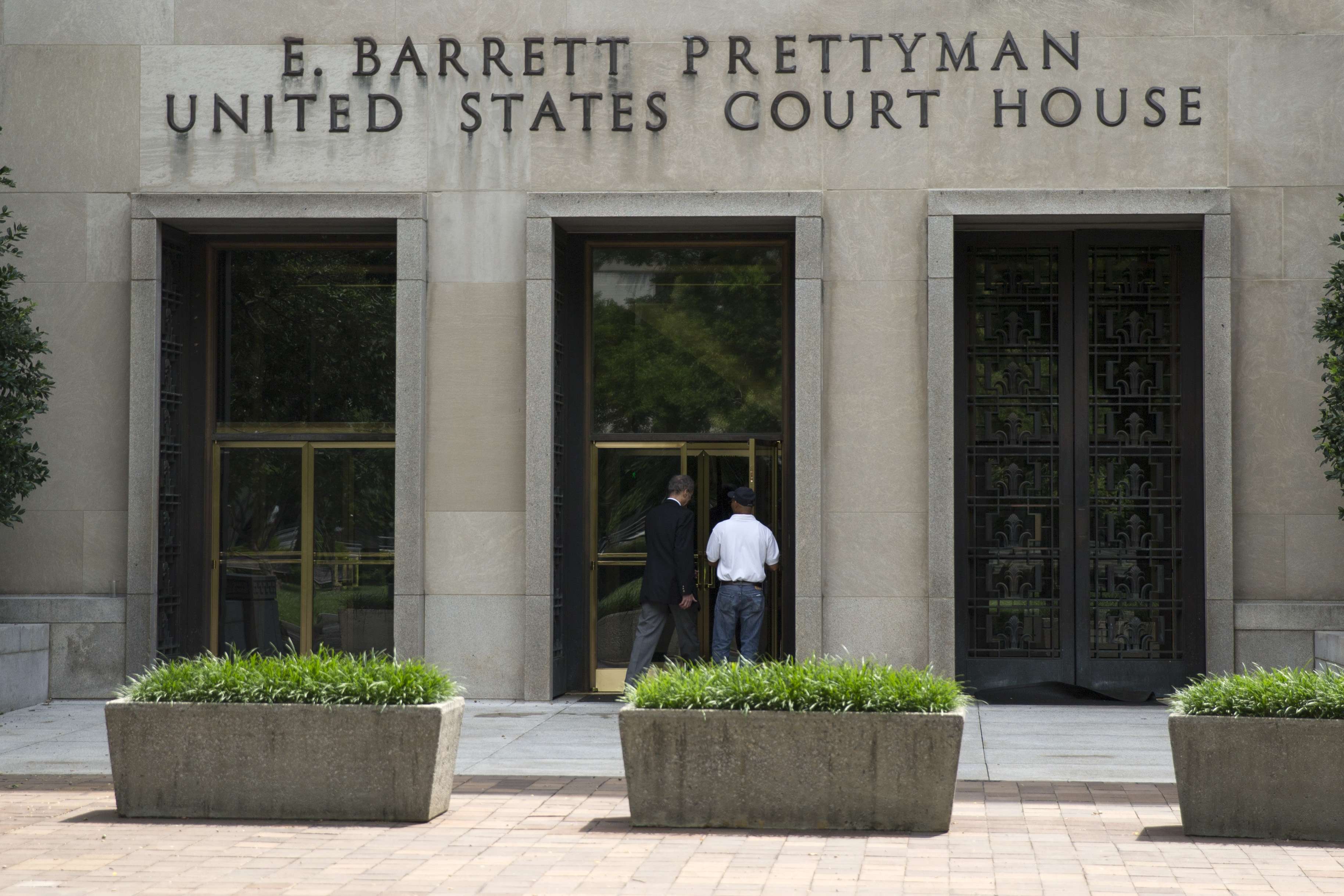 A view of the E. Barrett Prettyman Federal Courthouse that houses the U.S. Court of Appeals for the D.C. Circuit, on Tuesday, July 22, 2014, in Washington. Obama's health care law is enmeshed in another big legal battle after two federal appeals courts issued contradictory rulings on a key financing issue within hours of each other Tuesday. (AP Photo/ Evan Vucci)